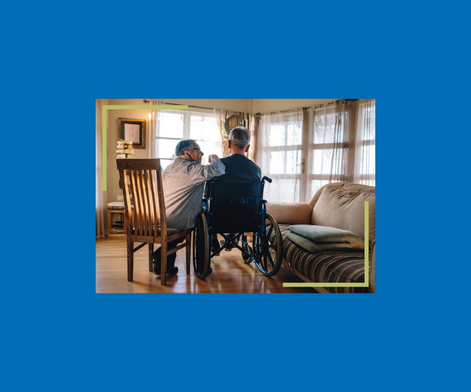 A senior couple inside their own home
